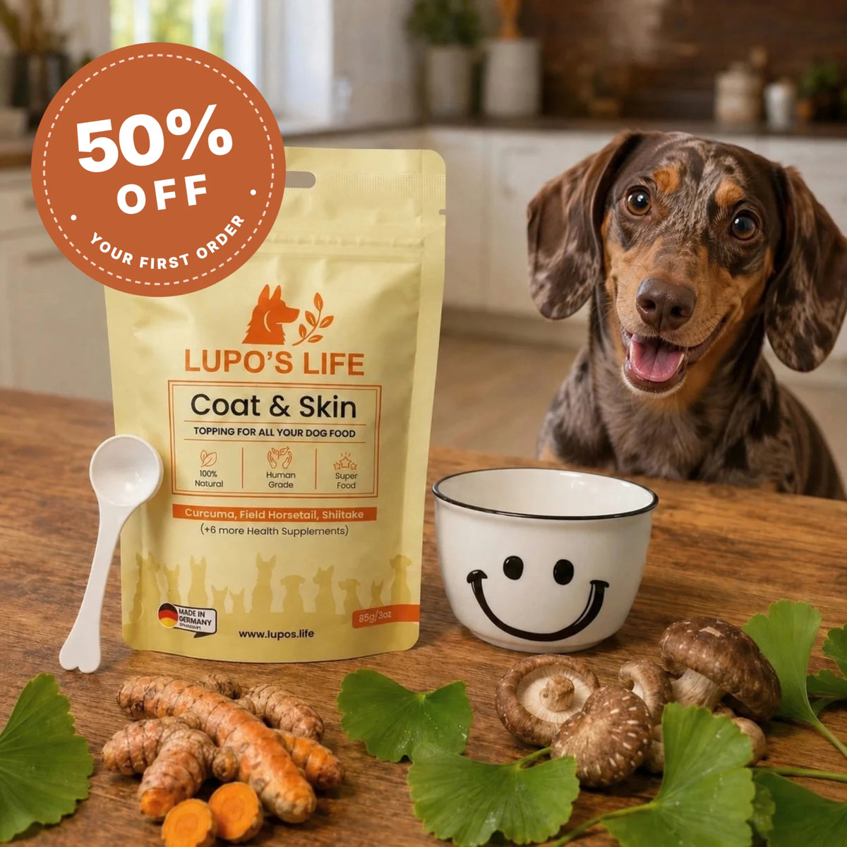 Lupo's Life Coat & Skin dog supplement pack next to a dapple dachshund, with turmeric, ginkgo leaves and shiitake