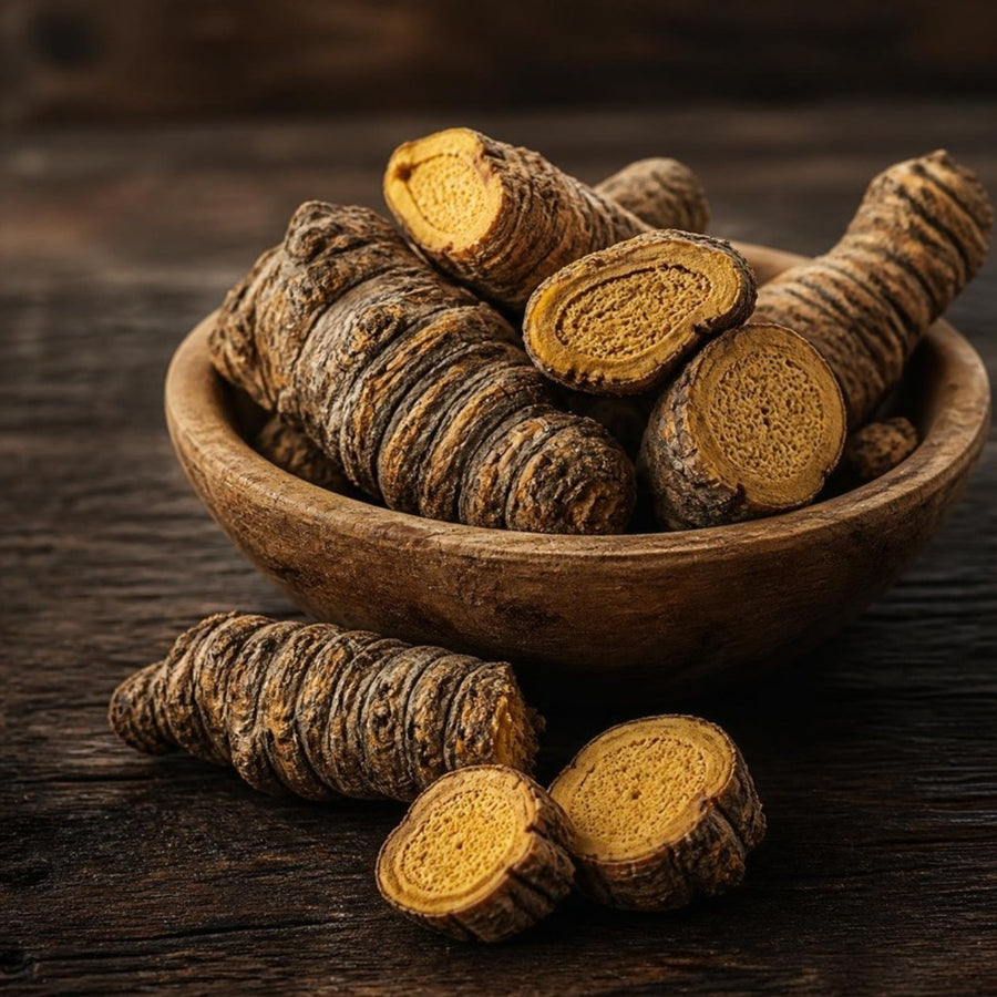 Dried gentian root pieces in a wooden bowl
